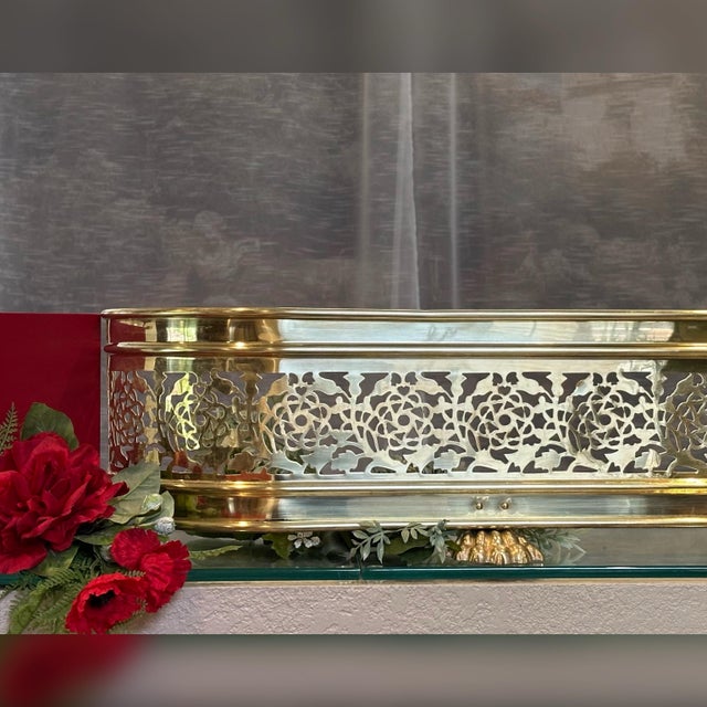 This is for an Antique Fireplace Fender that is brass in a pierced floral pattern with 4 very large lion paw feet that it...