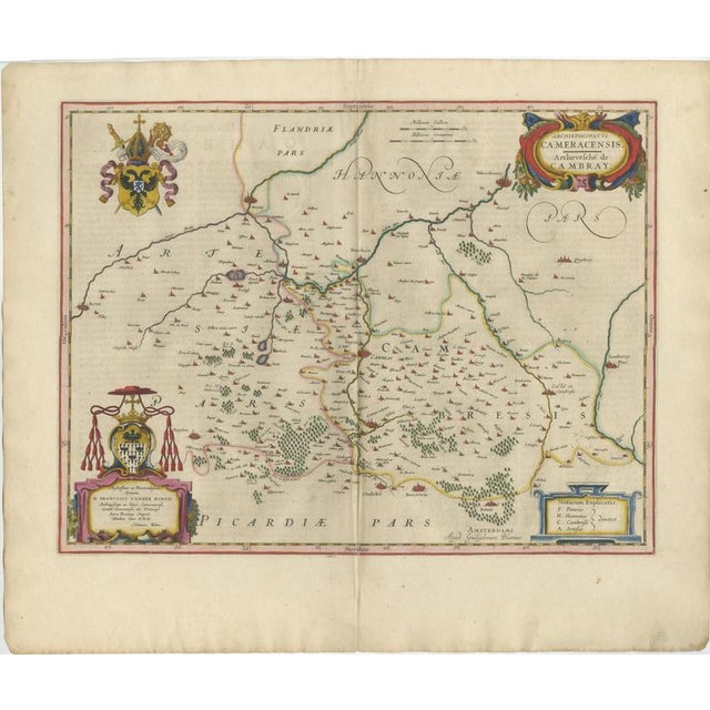A richly decorative and historically important map centered on Cambrai and the surrounding Artois region, engraved and...