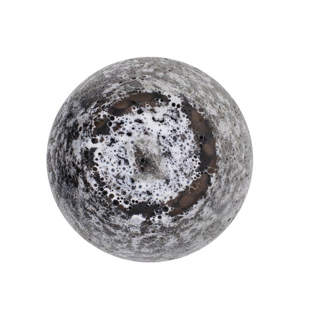 A blend of white, black, and bronze creates a rich and layered effect. The bronze detailing adds a subtle sparkle,...