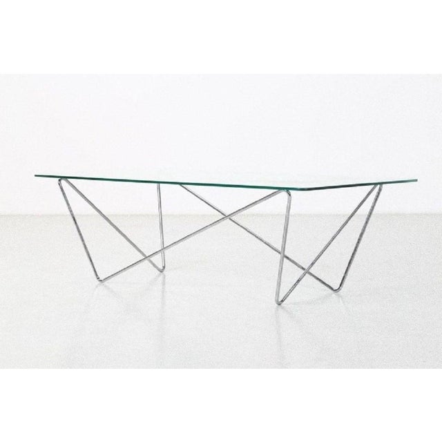 This glass table is an elegant design furniture realized in the 1970s by an Italian Manufacturer. Marvelous top in clear...