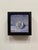 This oil painting captures a detailed depiction of a 50 Cent coin featuring John F. Kennedy, set against a softly...