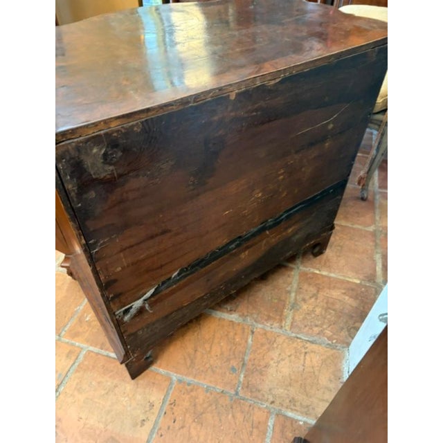 The Circa 1760 Burr Walnut Bombay Chest of Drawers is an elegant and timeless piece of antique furniture. This solid...