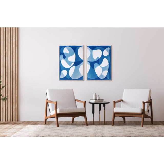 This unique cyanotype monotype diptych features fluid, interlocking shapes that drift across luminous fields of blue,...