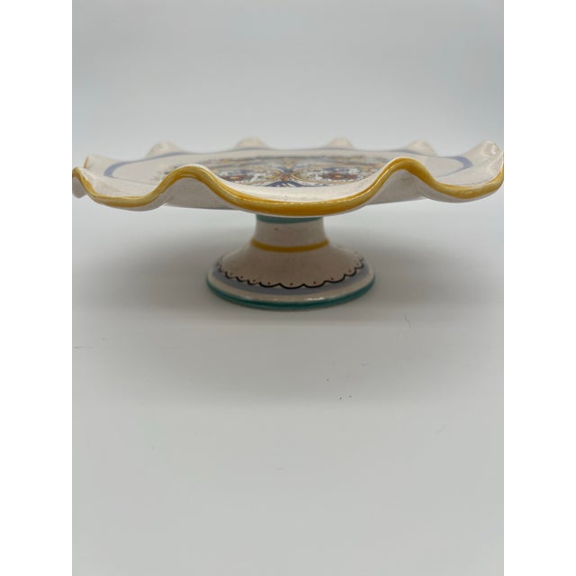 Beautiful Italian cake plate with a scalloped edge. Gold, green and blue design with a touch of red.