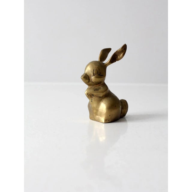 This is a vintage brass bunny figurine. The bunny rabbit figure makes a great paperweight or doorstop. Nice heavy weight...