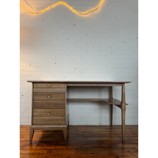 All-original 1950s Heywood-Wakefield cadence desk in classic wheat finish. Features three drawers (all function...