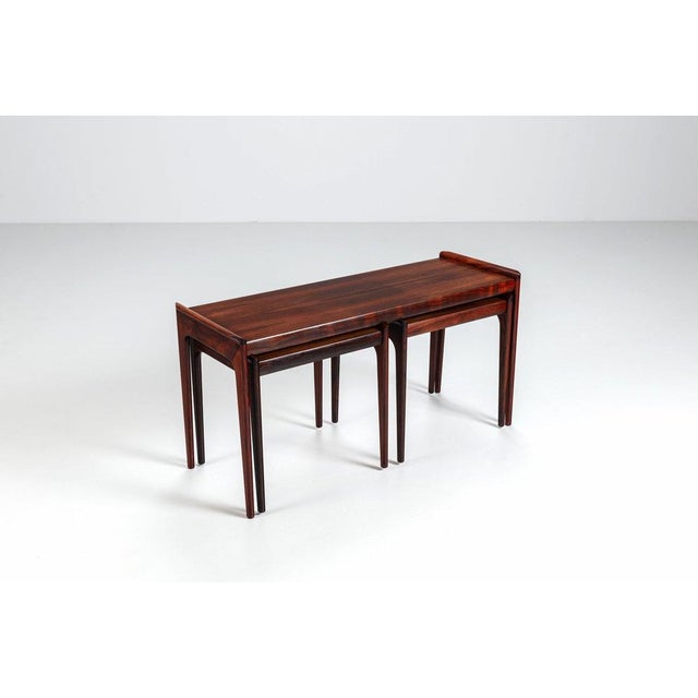 Beautiful set of nesting tables designed by Erling Torvits for Heltborg Møbler, Denmark, circa 1960. Crafted in richly...