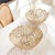 Light flowing vines make up the composition of this pair of metal decorative bowls. Fill with natural green orbs, or...