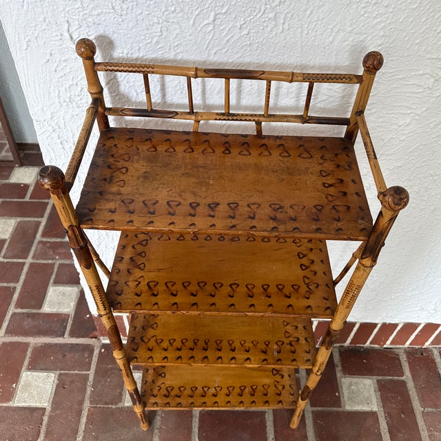 A wonderful example of an antique burnt bamboo shelving/etagere piece with hand finished burnt designs throughout the...