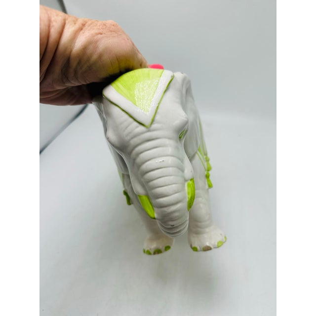 This is a wonderfully whimsical, sculptural planter — it reads almost like a little decorative objet rather than a simple...