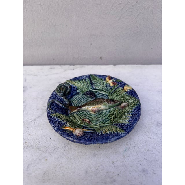 Small 19th Century round Palissy fish platter Thomas Sergent. decorated with a fish on the center ,on the border a snail,...