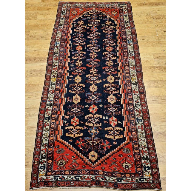 "The Persian Malayer wide runner in vibrant and character-rich colors represents a great example of early 20th-century...