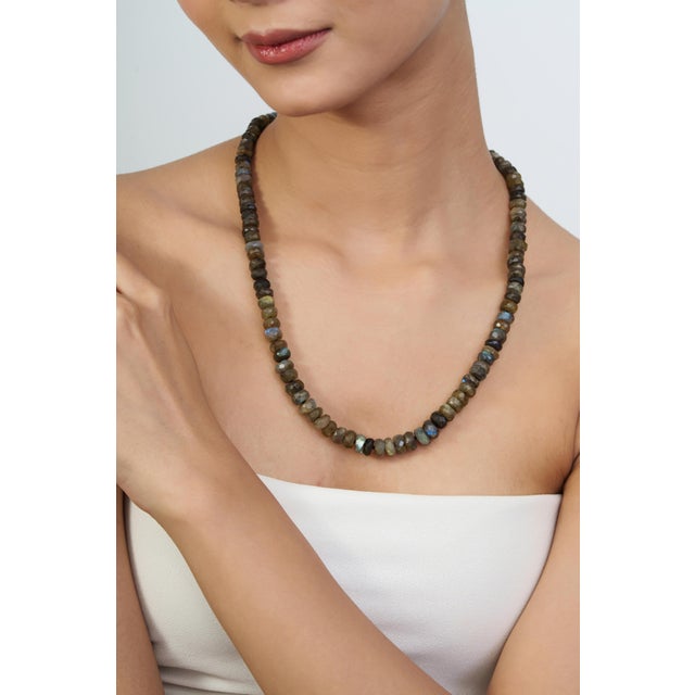 The 295 Ct Natural Labradorite Rondelle Beaded Necklace adds a distinctive touch to your jewelry collection, featuring 295...