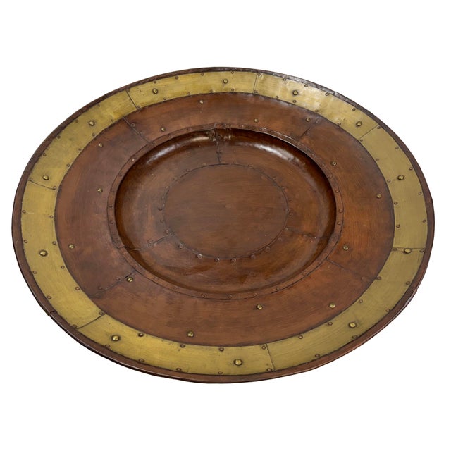 Substantial vintage Industrial style riveted metal tray. Copper and brass tones. Hook for hanging if desired. Age wear.