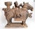 This Pair of antique Korean funerary pottery vessels in the form of riders on horses. The horses are standing four square...