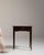 Carved walnut side table with drawer in Rich Walnut Brown. The rich walnut brown surface highlights single drawer, brass...