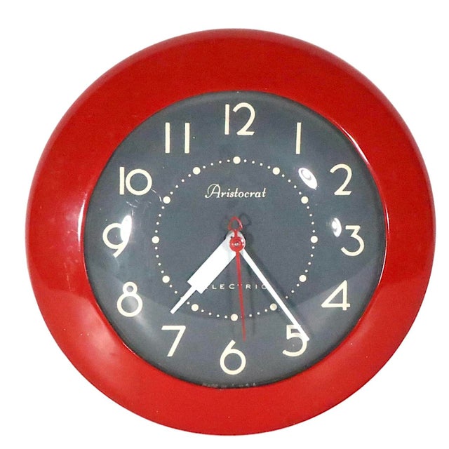 Mid Century Retro kitchen wall clock, "Aristocrat" by Ingraham. The clock features a red metal border, with a gray and...