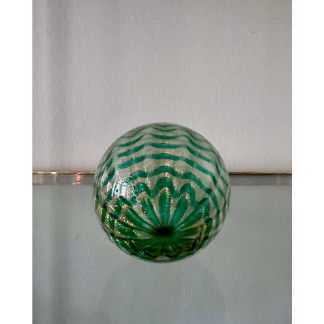 Small Murano art-glass bulbous, ornament-form bud vase with green linear and gold aventurine fleck decoration throughout....