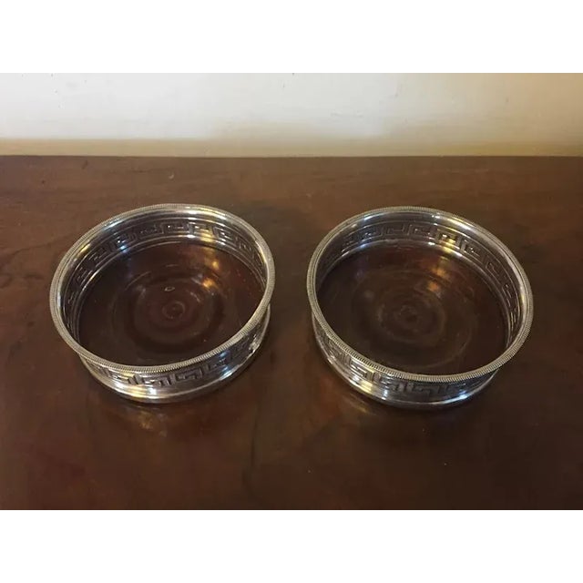 Pair antique early 19th century English Regency old Sheffield silver plate on copper wine coasters. Decorated with Greek...