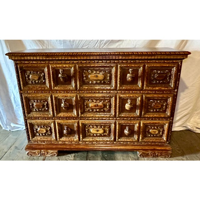 A striking carved chest in the Continental European, likely German or Alpine tradition, distinguished by its deeply...