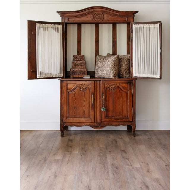 An exceptional late 18th-century French Provincial buffet à deux corps, dating to approximately 1770–1790, with the...