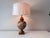 Vintage ceramic palm tree and bamboo relief designed table lamp paired with a large linen barrel shade.