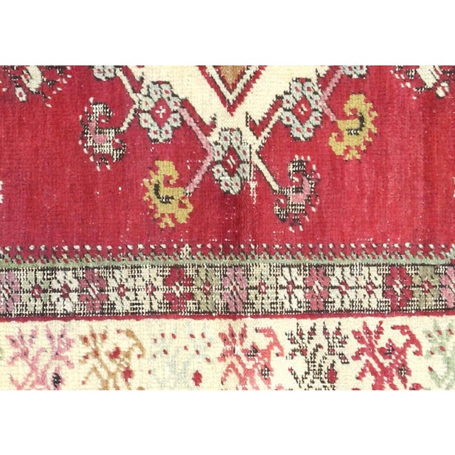Crafted by skilled artisans in the Oushak region of Western Turkey, this Vintage Turkish Oushak Rug showcases the rich...