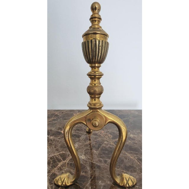 This Brass Fireplace Andiron Set features the refined touch of Italian craftsmanship, offering a simple yet elegant design...