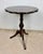 Elegant English side table, featuring a shaped octagonal top raised on a finely turned pedestal with a classic tripod...