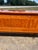 A sophisticated French Art Deco sideboard, circa 1940, showcasing richly figured light Macassar veneer with an elegant...