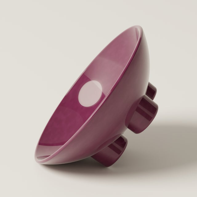 A sculptural ceramic bowl with a super glossy finish, ideal for fruit, dried flowers, or as a standalone art object. Part...