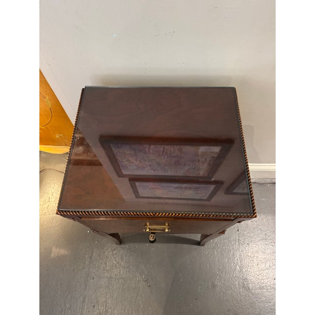This is 1940s Vintage side table. It was made by Berkey and Gay. It is crotch mahogany. It has one large drawer for...