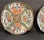 A pair of antique Rose Medallion pattern Chinese plates. Famille rose color family enamel over white porcelain. Each...