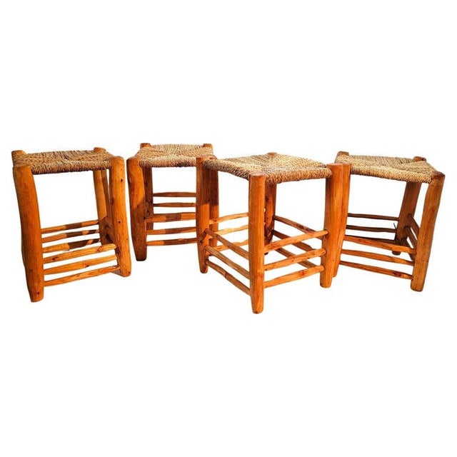 These amazing hand carved pine stools have hand woven sea grass seats.The set are in pristine condition.Great at a low...