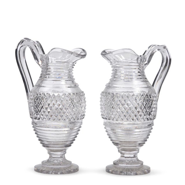 Large pair antique early 19th century George III Anglo Irish cut crystal wine ewers or water pitchers. Each with...