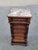 Beautiful 19th-century French walnut bedside cabinet featuring a striking marble top, turned columns, paneled drawers, and...