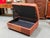 Design Plus Gallery presents a Cognac Leather Distressed Ottoman with Storage. The pure hide piece is an elongated...