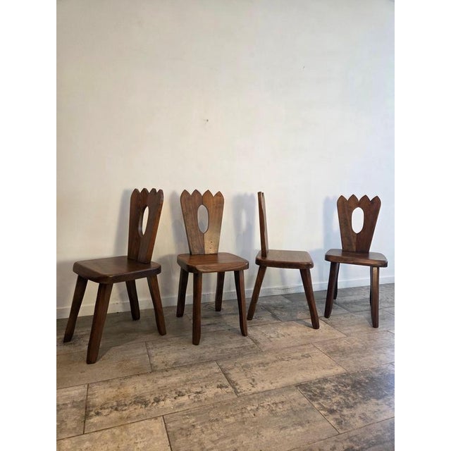 An exceptional and highly collectible set of four "King" dining chairs designed by Finnish architect and designer Olavi...