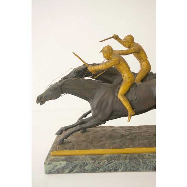 This classic and stylish English Edwardian sculpture depicts the climactic moment of the finish-line as the horses are...