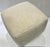 Stylish Caracole Modern Off-White Marshmallow Ottoman, black base, showroom floor sample