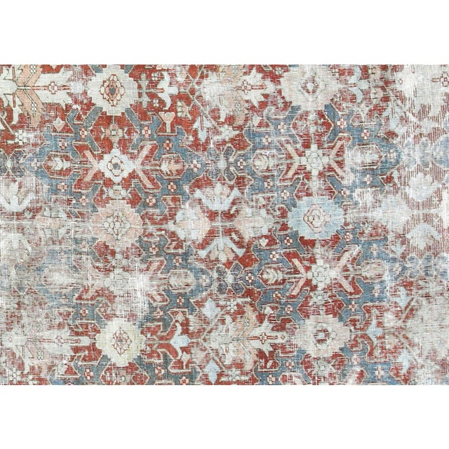 This impressive Semi Antique Persian Heriz Rug, with its substantial dimensions of 11'2" x 16'10", exemplifies the...