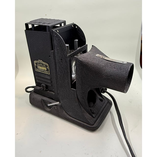 Embrace mid-century industrial design with this striking 1940s SVE picture miniature slide projector model RK....