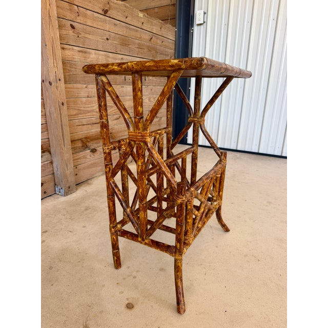 A charming vintage faux bamboo side table featuring an architectural lattice-form base and a natural grasscloth inset top....