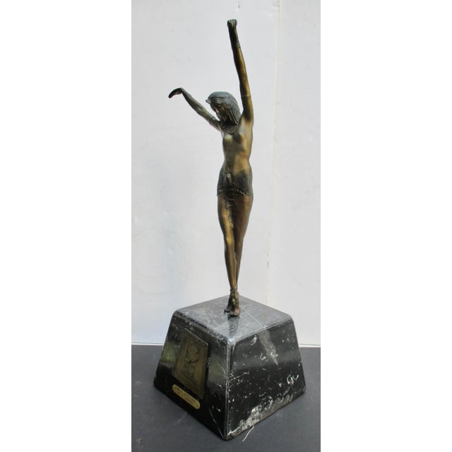 Late 20th century cast Brass Art Deco Dancer. Styled after well-known Chiparus bronze Deco sculptures. A tall, thin female...