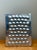 This vintage modernist aluminum vase is a striking example of mid-20th-century design, celebrating geometry, texture, and...