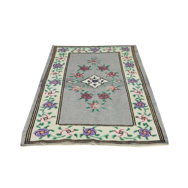 Handknotted vintage decorative rug from Oushak region of Turkey. Approximatelly 35-45 years old. In very good condition.