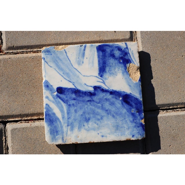 Circa: 18th Century. Country: Portugal. Material: Earthenware, Tin-glazed pottery. Note: This tile was once part of a...