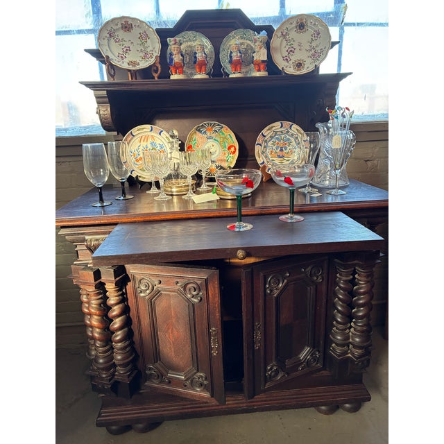 Antique Renaissance Revival /Baroque style carved Buffet with a raised plate rack superstructure. Featuring distinctive...