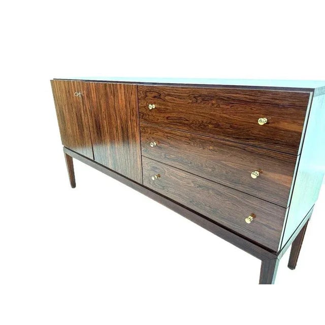 vintage Palette Möbelwerk sideboard, produced in the 1970s in Germany. The sideboard has two doors and three drawers with...