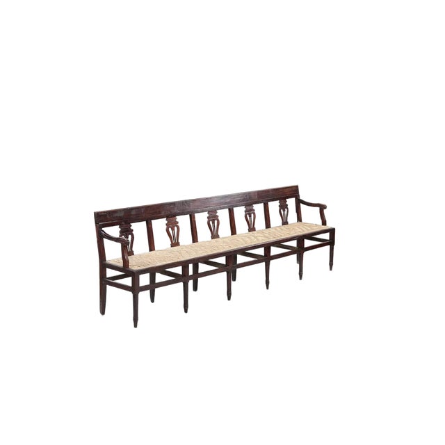 A handsome and unusually long antique Neoclassical bench featuring an elegant series of hand-carved lyre-form splats...